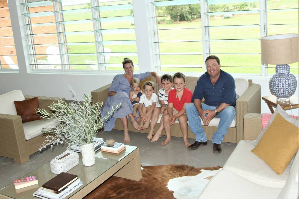 Jayde and Ben Chandler and their children Viv, Wally, Charlie and Jack relaxing in the ground-level living space.