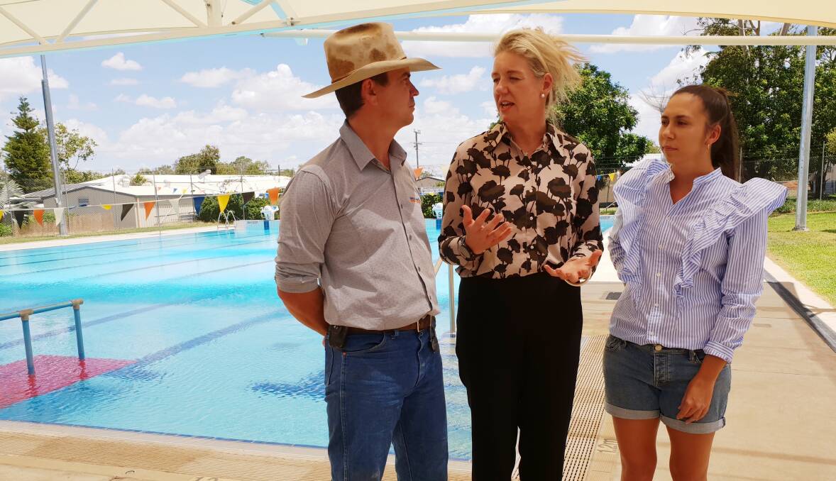 Barcaldine Regional councillor, Sean Dillon, left, and Alpha swimming advocate, Danielle Taylor, right, explain the need for innovative funding for rural families to access swimming lessons to federal sports minister, Bridget McKenzie. Picture - Sally Cripps.