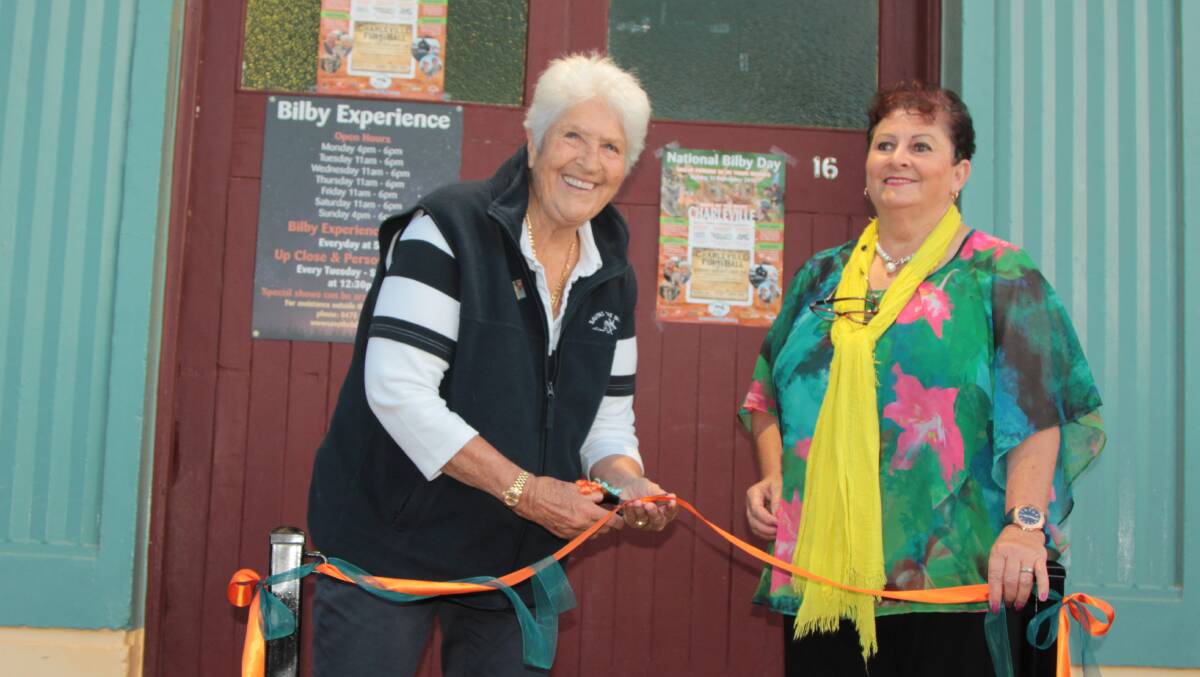 Doors open: Australian icon Dawn Fraser joined Murweh shire mayor Annie Liston in cutting the ribbon to open the Bilby Experience at the Charleville railway station. Pictures: Sally Cripps.