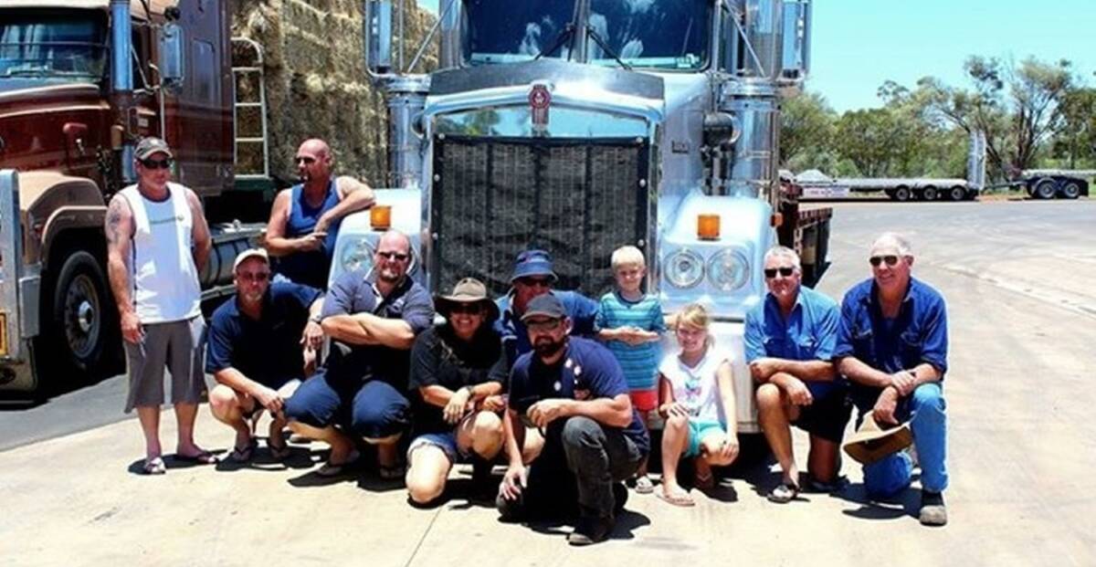 Group hug: Bo and Toby were surrounded by well-wishers when the Burrumbuttock Hay Runners were homebound on Sunday. Picture: Wendi Burtenshaw.