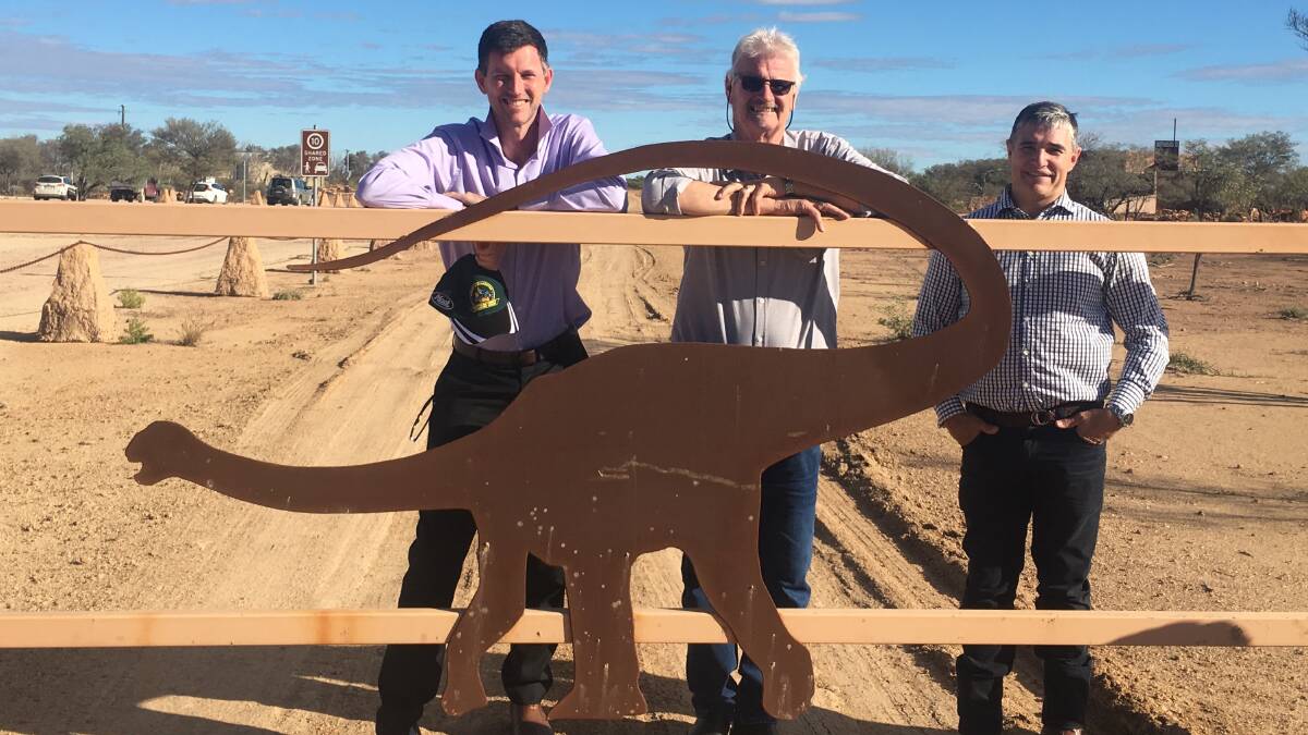 Large load: Announcing the Transport and Tourism Connections program at the Australian Age of Dinosaurs site at Winton were Main Roads Minister Mark Bailey, Winton mayor Butch Lenton and Member for Mount Isa, Rob Katter. Photo: contributed.