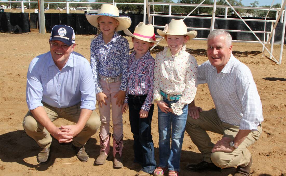 Prime Minister Scott Morrison and deputy Prime Minister Michael McCormack with some of their youngest fans, Breanna Easton, Camaray Downs, Richmond, and Sophie and Issie Spreadborough, Spoonbill Station.Julia Creek.