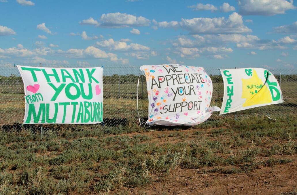 Giving: Signs of thanks flutter from a Muttaburra fence. Droughted recipients say the physical presence of trucks and drivers means as much as cash. Photos: Sally Cripps.