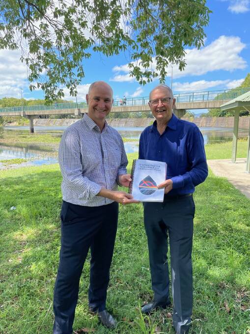 Queensland Water Minister Glenn Butcher and Professor Ross Garnaut with the report into the feasibility of Bradfield-like schemes. Picture: Supplied