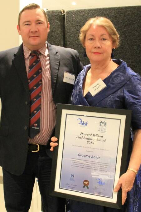 Tom and Jennie Acton accepting the Howard Yelland award on behalf of their late father and husband, Graeme Acton. Photo supplied.