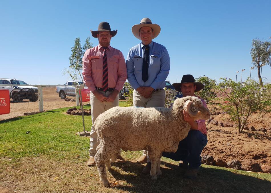 Joe Groves, Elders Barcaldine, and Barcaldine Downs overseer, Matt Baker, with Ben Childs and the equal top priced Merino ram from the sale.