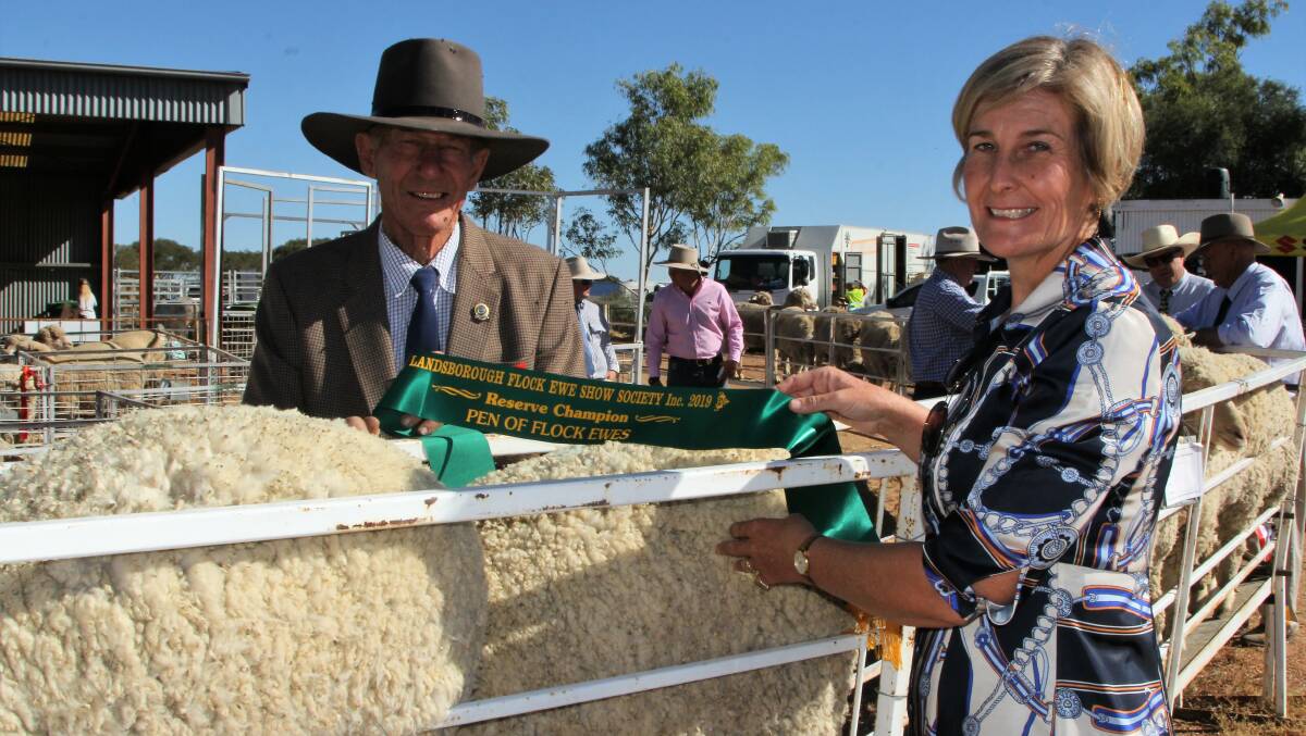 Stuart Bowden, Penlan Downs, Muttaburra with Sarah Fysh, Acacia Downs, Muttaburra and the reserve champion pen of flock ewes.