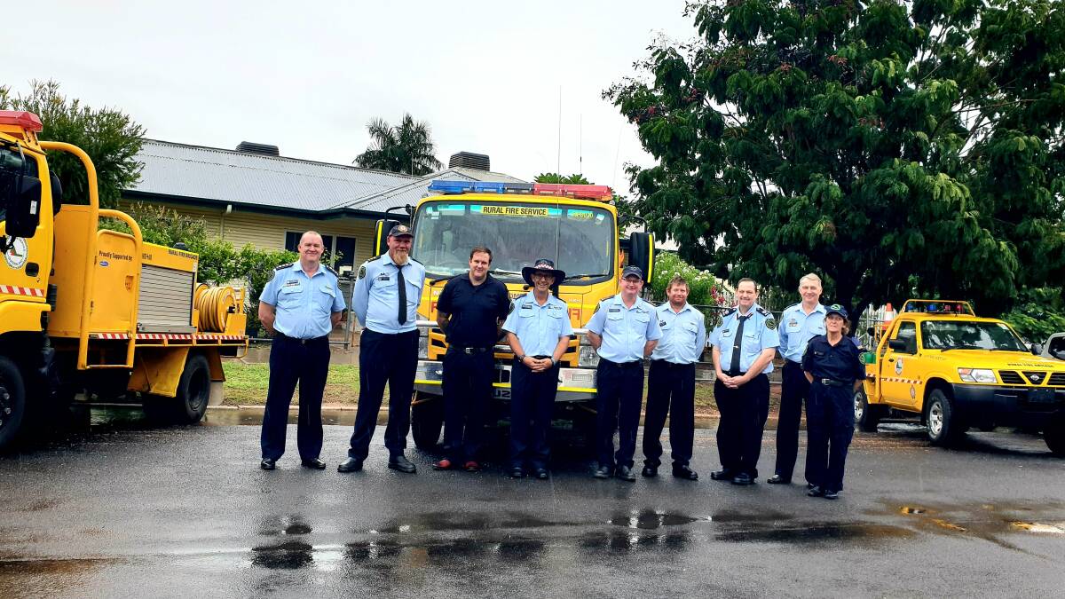 Rain was coming in as Rural Fire Brigade volunteers from Ilfracombe, Muttaburra and Jericho took delivery of new fire-fighting units to improve their coverage of the region. Picture: Sally Gall