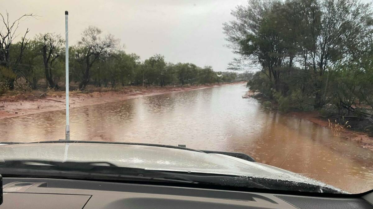 Ivan King was loving the sight of the flooded Pitherty Road on his property, Mooning, south of Eulo, on Friday.