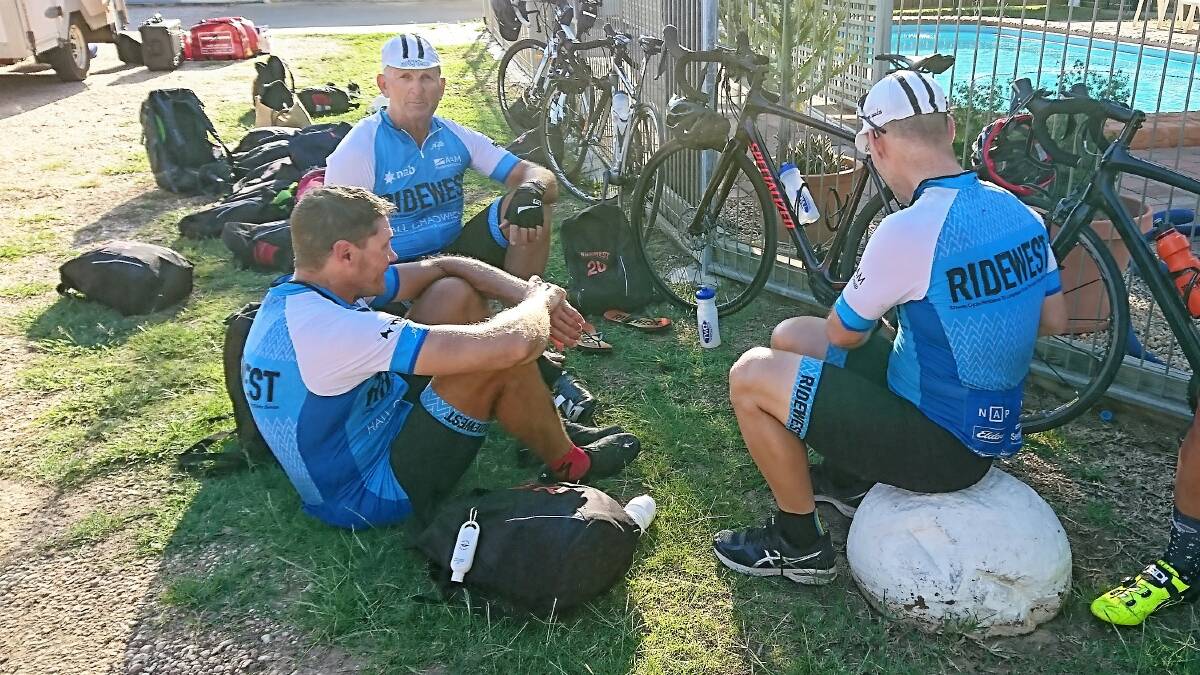 Charles Burke and fellow riders relaxed at the end of the second-last leg, which took them as far as Blackall.