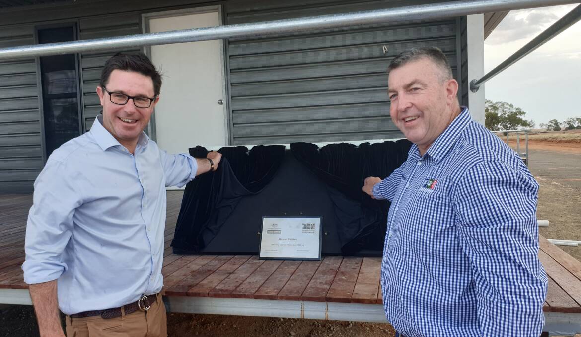 Federal Agriculture Minister David Littleproud and Murweh Shire Council Mayor Shaun 'Zoro' Radnedge prepare to unveil the plaque for the new Morven Rail Hub.