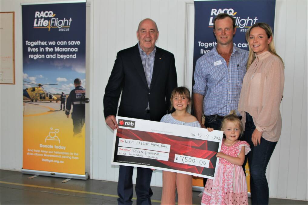 LifeFlight Australia chairman Rob Borbidge accepts a cheque from George, Jami-Lee, Darcy and Mackenzie Hill on behalf of the Tooloombilla Rodeo and Campdraft committee. Photo: Sally Gall