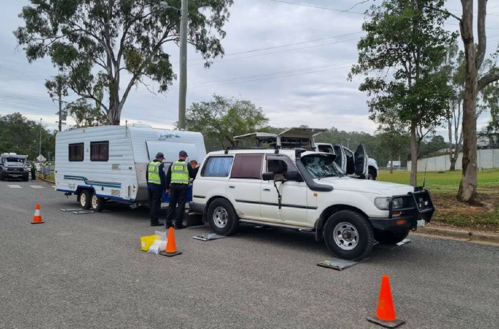 Police weighing a loaded caravan at Gympie. Picture: supplied