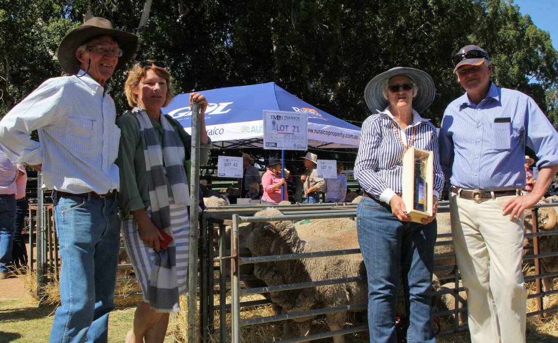 A commemorative bottle of port was on hand for David and Heather Morton, purchasers of the poll ram whose proceeds were donated to West'n'Breast, pictured with Terrick Merinos principals, Jenny and Rick Keogh.