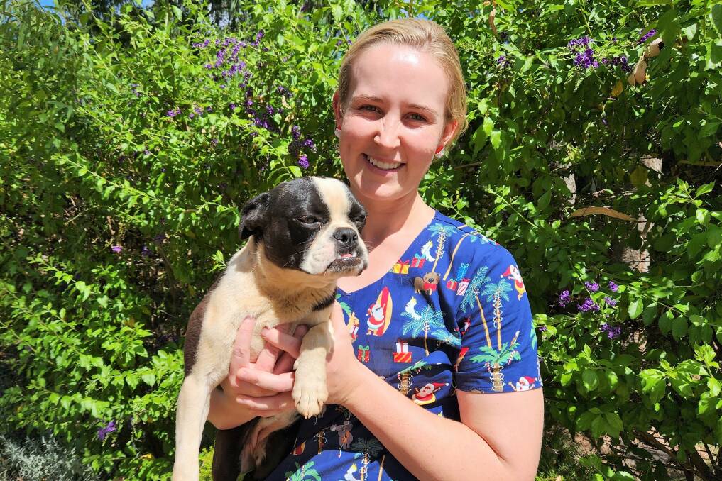 Charleville vet Dr Courtney Scott, pictured with her Boston terrier Daphne, says vets' roles are being undervalued, by themselves and the community.