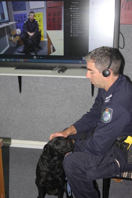 There's a close relationship between police dogs and their handlers, such as this one between PD Violet and Snr Constable Cam O'Sullivan.
