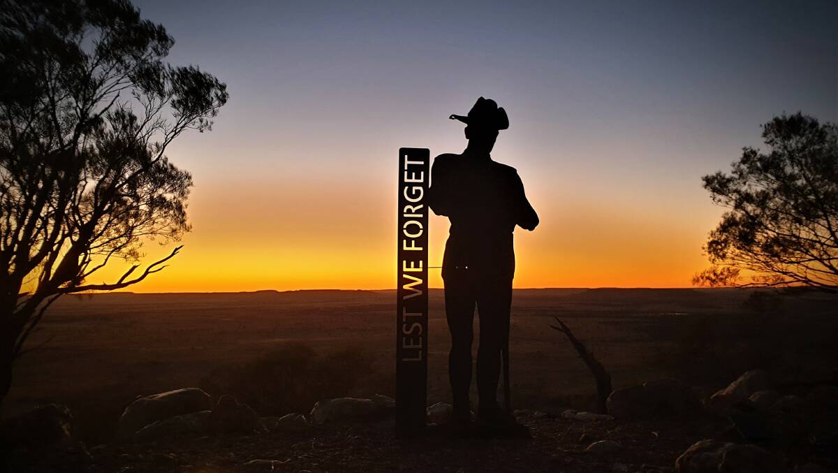 A silhouetted soldier made by Centwest Engineering stands in the dawn light at Mt Slocombe near Yaraka.