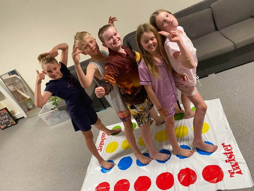 Year five Capricornia School of Distance Education students Libby, Nate, Cooper, Sophie and Heidi loving being back together in their refurbished accommodation at Emerald. Pictures supplied.
