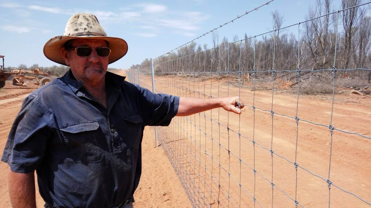Ronald Sevil at his exclusion fence, constructed as part of the Neabul Wallum cluster, funded under phase two of the Collaborative Area Management project.
