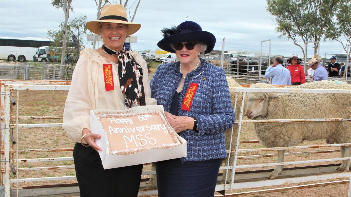 Muttaburra Stock Show president Lisa Magoffin and long-term committee member Margie Webb with the 60th anniversary cake. Picture: Sally Gall