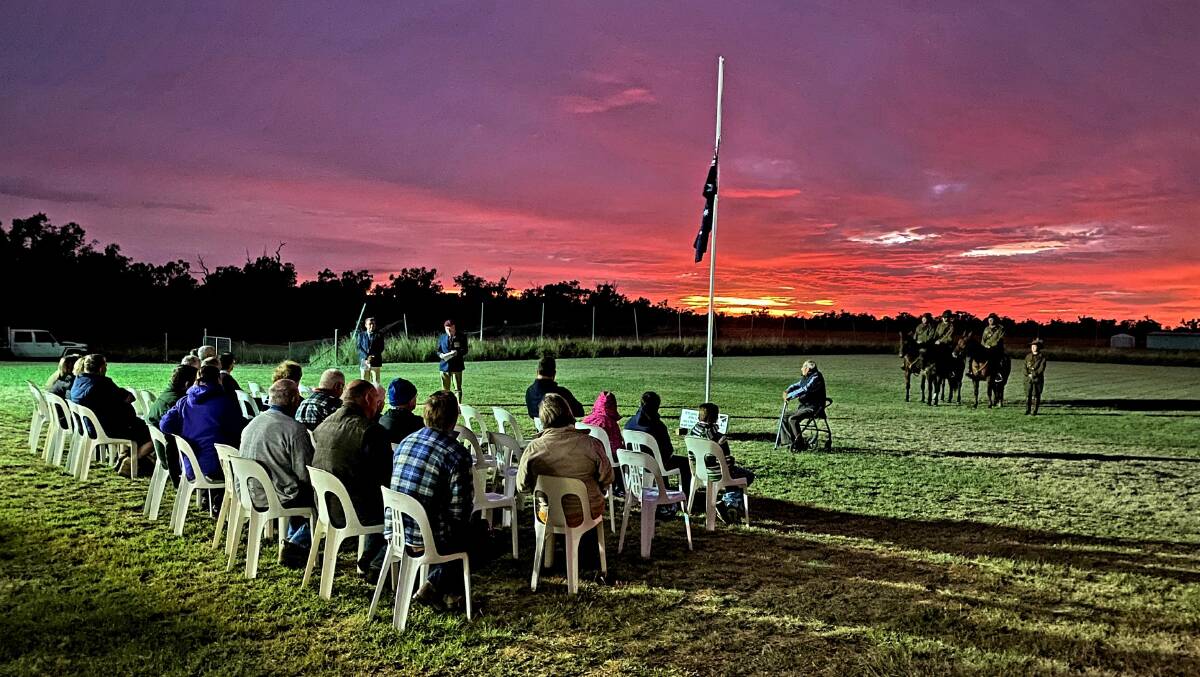 Clouds provided a spectacular backdrop for the dawn service at Hodgson, 15km west of Roma. Picture: Justin Rudd
