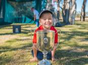 Roma's Alfie Ruhle eyes off the Kirkwood Cup, presented to the winner of the Australian PGA championship, Picture: Reuben Nutt