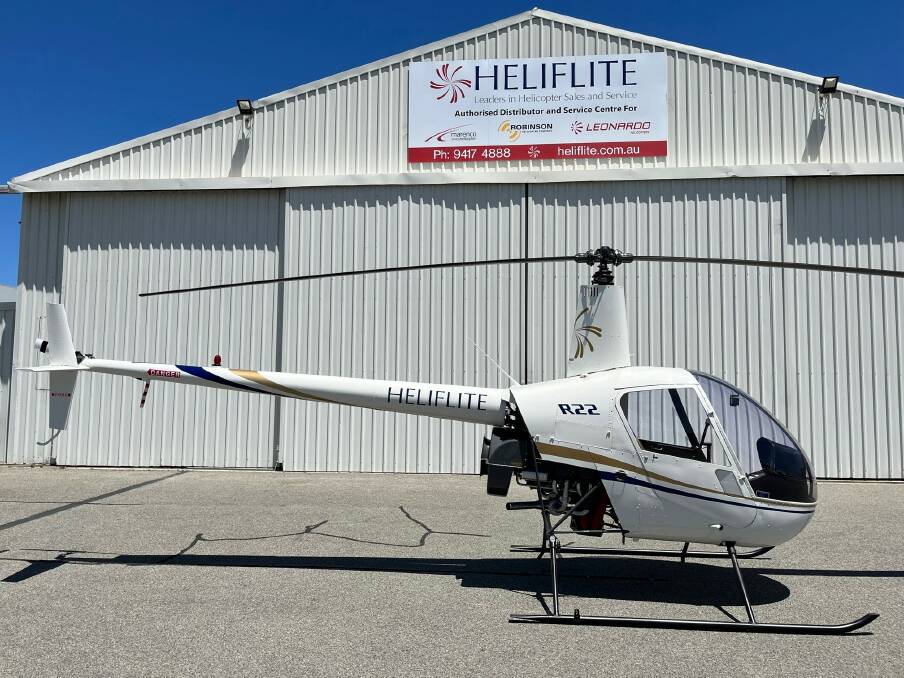 The refurbished R22 standing in front of the Heliflite hangar at Jandakot, WA. Picture: supplied