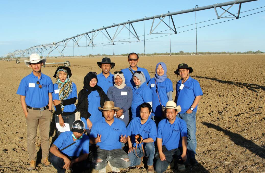 Dryland production: Some of the Indonesian beef exchange group inspecting the fodder irrigation plot at the Longreach Pastoral College. Pictures: Sally Cripps.