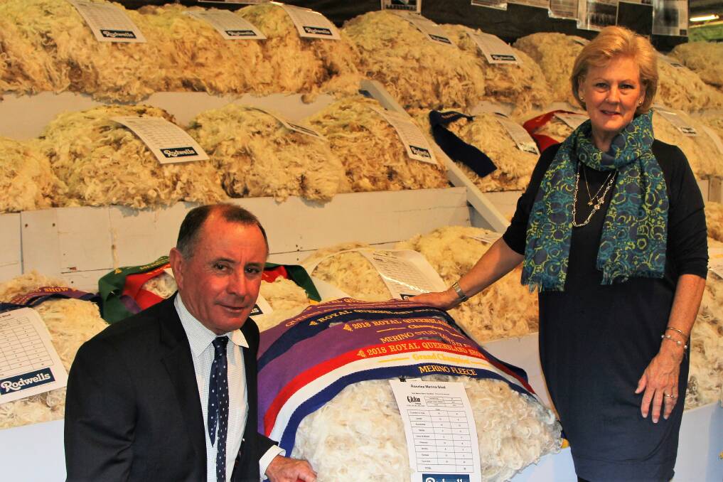 Wool champions: Peter and Linda Hacker, Roselea, Muckadilla, with their prize-winning ram's fleece, part of the eye-catching Ekka display. Picture: Sally Cripps.