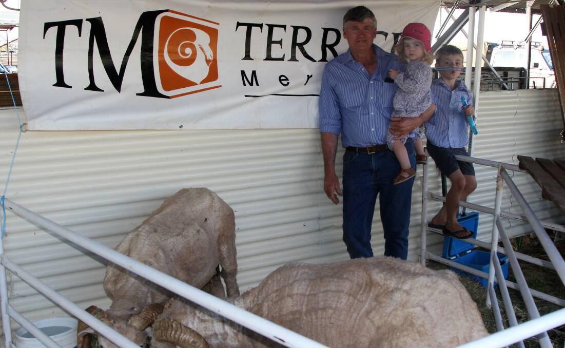 Terrick Merinos principal, Rick Keogh, pictured with two of his grandchildren, Ivy and Henry McLane, had rams and wool on display at the state sheep show.