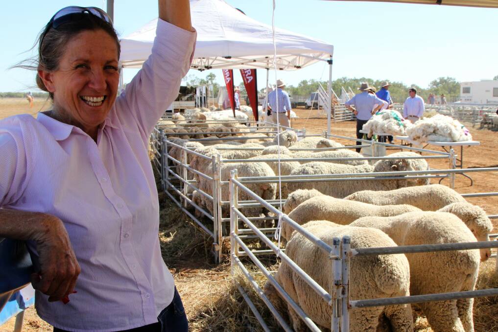 Happy days: Karen Huskisson brought six rams up for the Isisford show and said she was enjoying being part of an optimistic buzz. Picture: Sally Cripps.