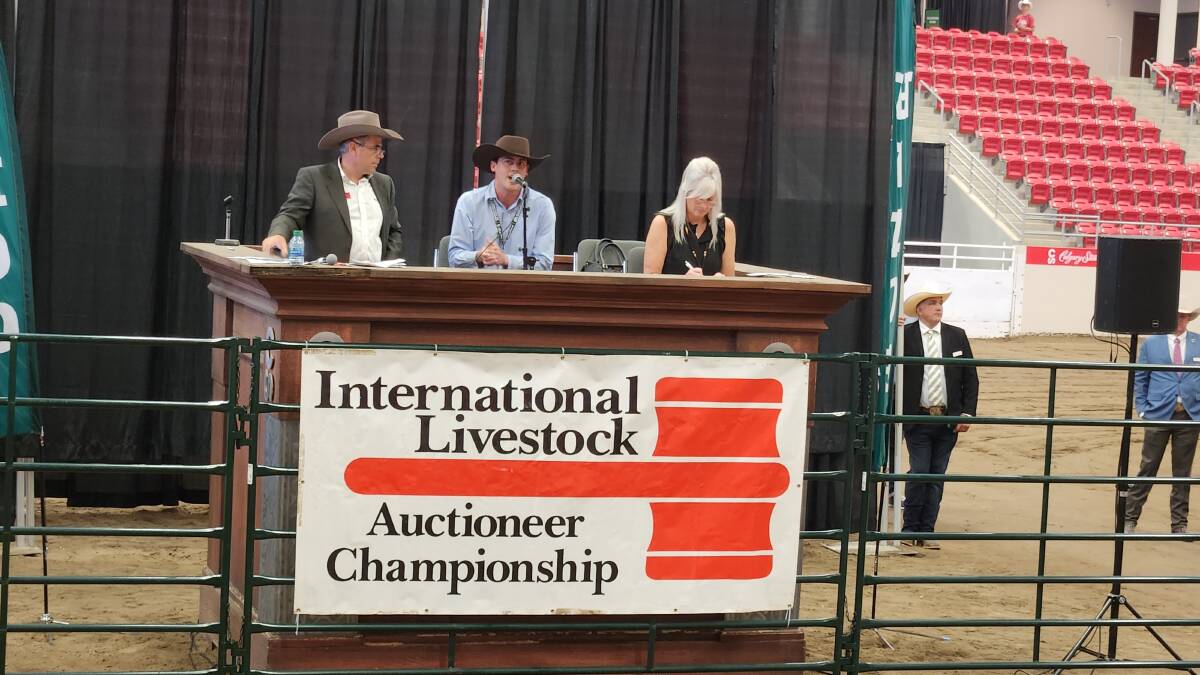 Australia's representative in the International Livestock Auctioneer Championship, Harry Waters, centre at the podium in Calgary. Picture: Sally Gall