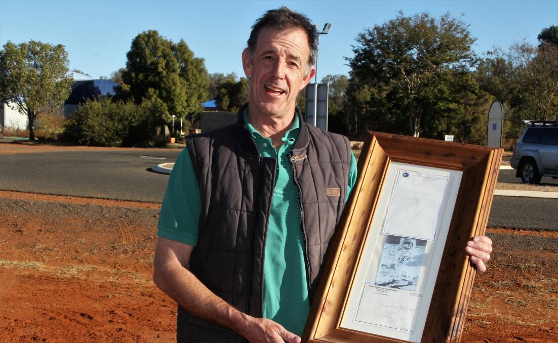 Alan MacDonald, Charleville with the framed letter he received from Neil Armstrong.
