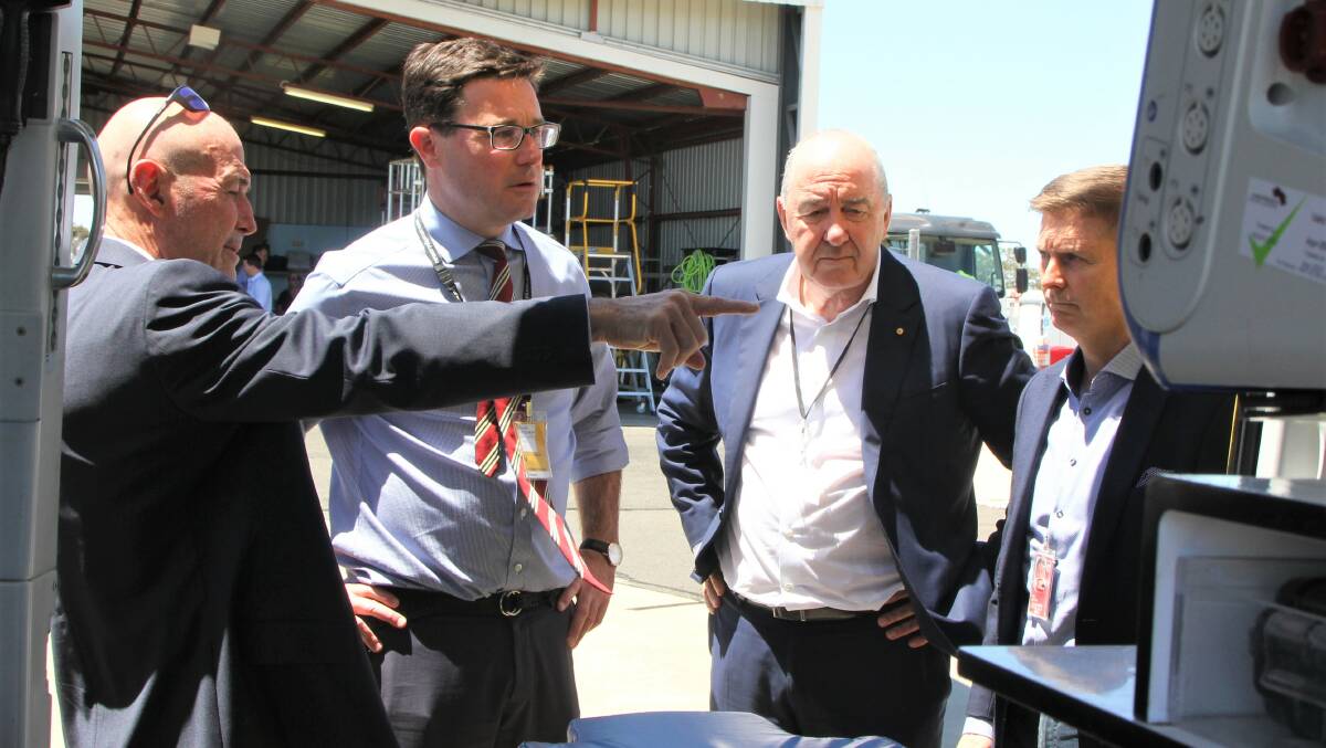 LifeFlight's deputy chairman Jim Elder, chairman Rob Borbidge and director, rotary wing operations Brian Guthrie explain various aspects of the helicopter stationed at Roma to Maranoa MP David Littleproud.