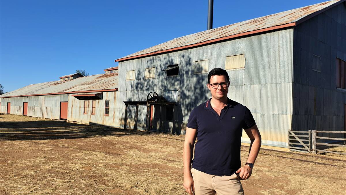 Reinventing the wheel: AEC senior economist Jonathan Pavetto in front of the the woolscour that operated in Blackall between 1908 and 1978. Picture: Sally Gall.