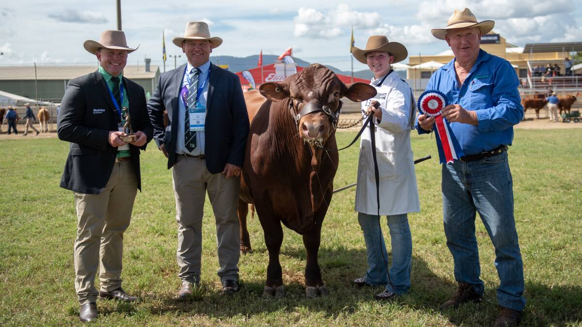 Colby Ede, Nutrien livestock coordinator southern Queensland, judge Matt Welsh, grand champion Senepol bull 5 Star Munster led by Greta Dunne, and trophy presenter Tony Baker.
