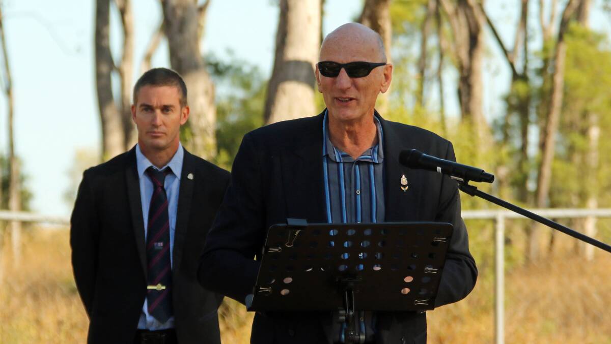 Injune RSL sub-branch president Hermann Kamin addressing the crowd at the ceremony, with Bryce Duke watching.
