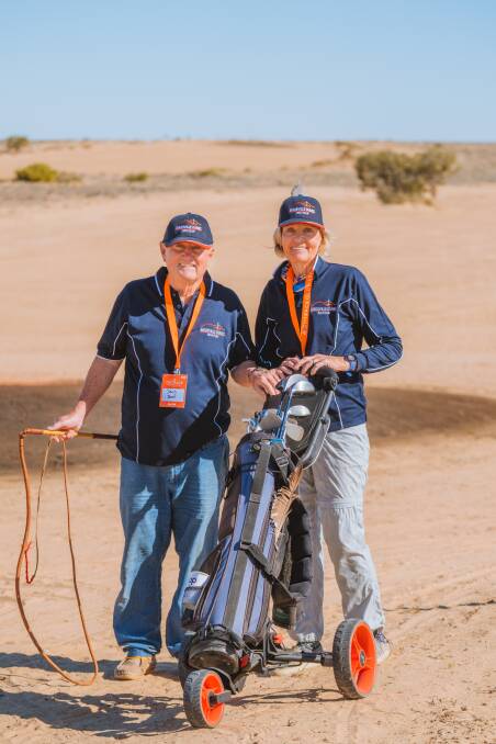 Birdsville's Nell Brook, right, with the whipcracker keeping crows from stealing balls on the course.