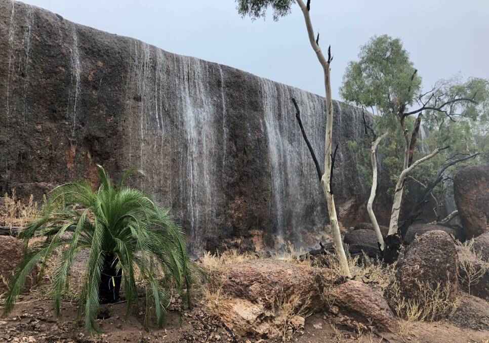 Rain at the Australian Age of Dinosaurs museum to the east of Winton created a mini waterfall this week. Photos courtesy of AAOD.