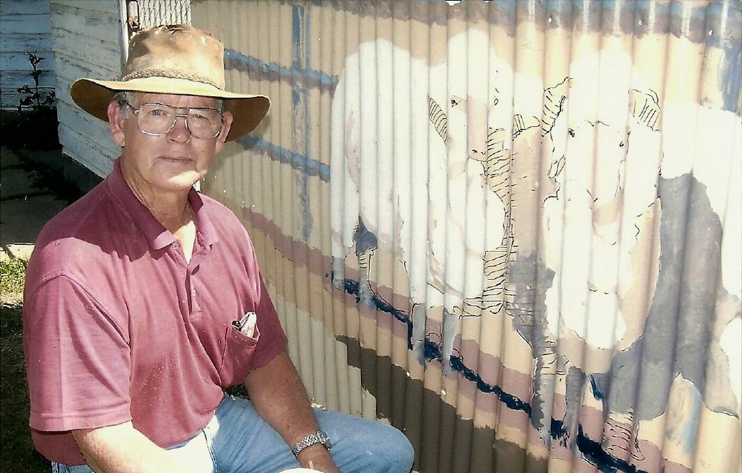 The late Bill Cox of Augathella with one of his pieces of art. Photo supplied.