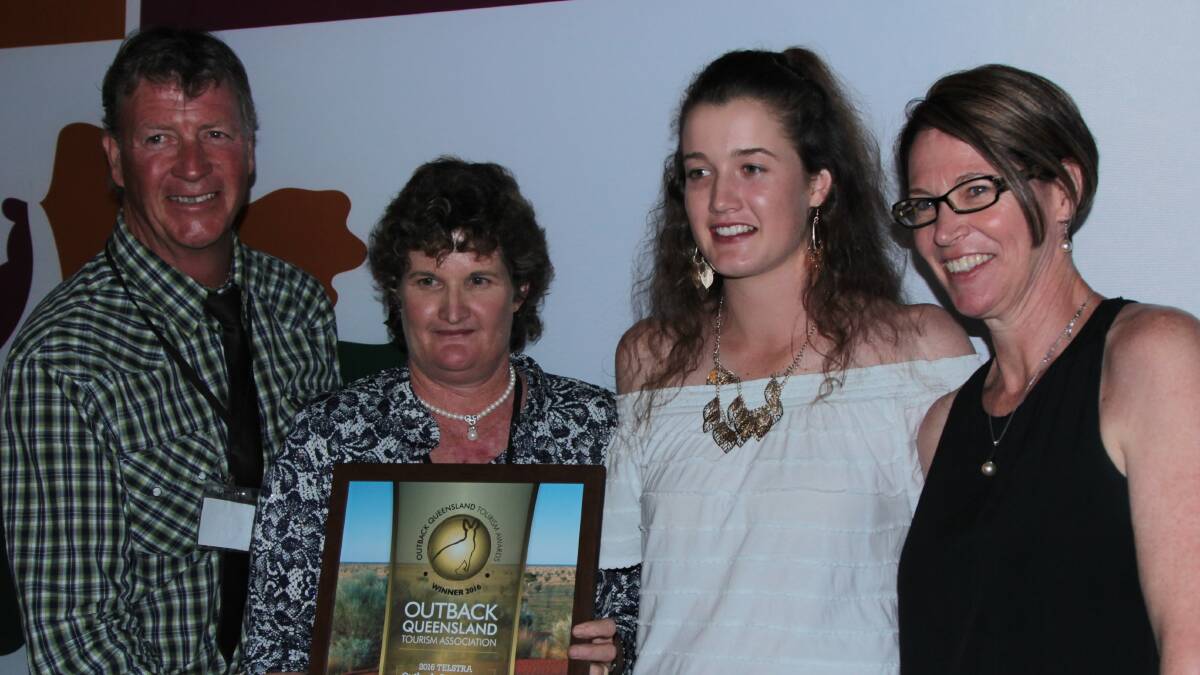 Winners are grinners: Cobbold Gorge tourism operators Simon, Gaye  and Anna Terry, plus Glenda Daly, with one of three awards won at the outback Queensland awards night in Windorah. Picture: Sally Cripps.