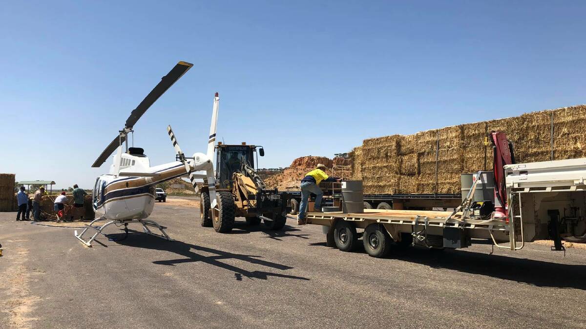 A Landsborough Highway truck stop north of Winton was a hive of activity last February once roads were open and hay could get through to be ferried out to weak cattle in the paddocks.