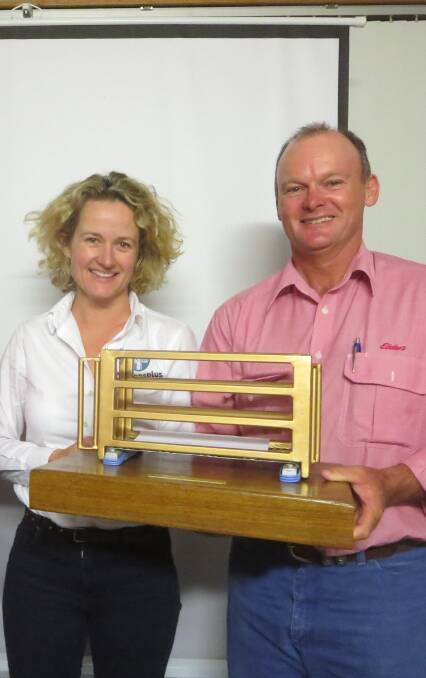 Top job: AuctionsPlus CEO Anna Speer presents Elders' western Queensland livestock manager Tim Salter with his trophy as the nation's top sheep assessor for 2015.