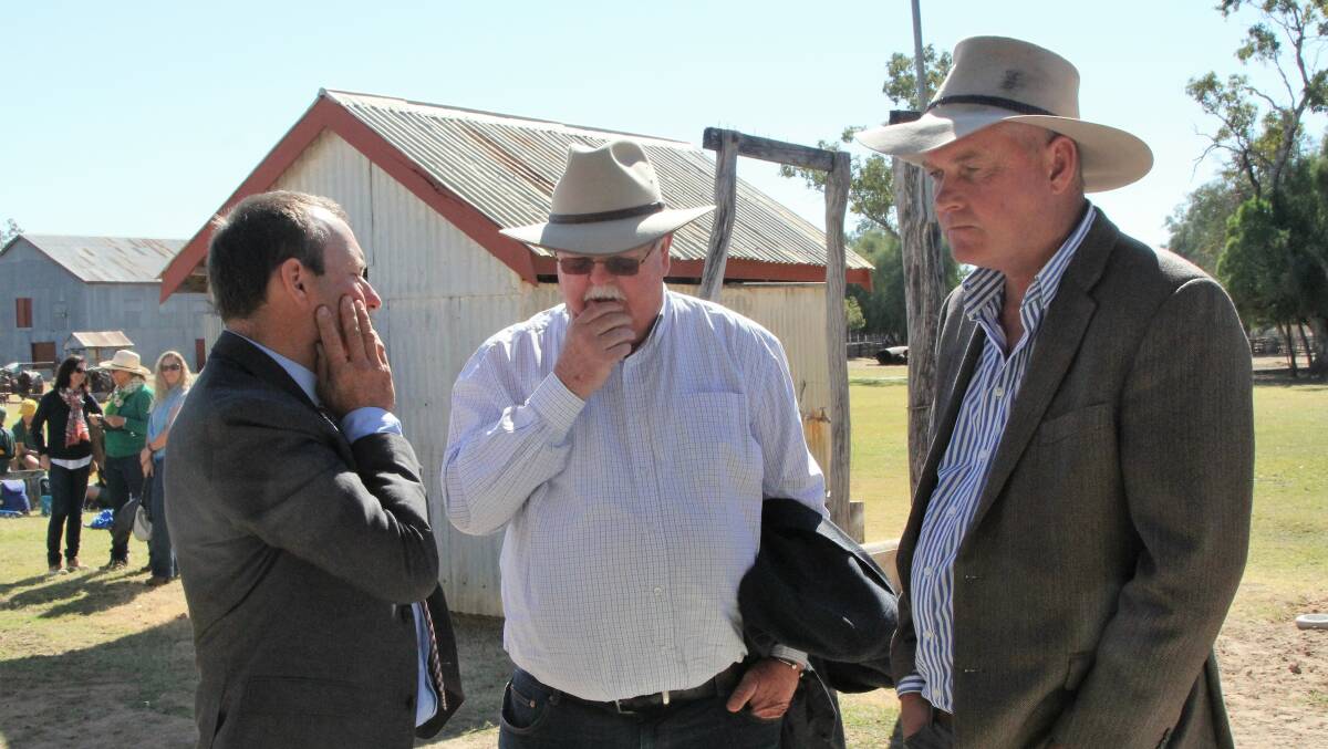 Senator Barry O'Sullivan, centre, discussing drought assistance options with AgForce northern region director, Dominic Burden, and the Member for Gregory, Lachlan Millar, at the Blackall Woolscour recently.