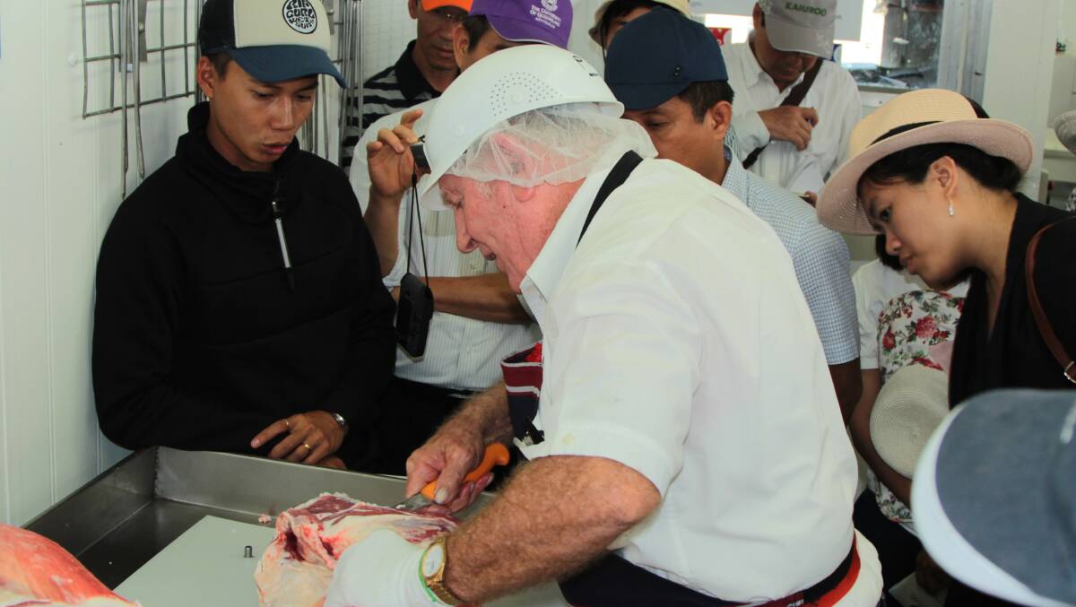 Clear cut: Longreach Pastoral College butcher Pat Tanks demonstrated various cuts of meat to the watching Vietnamese delegation. Picture: Sally Cripps.
