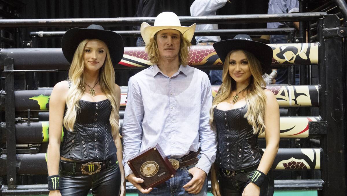 Aaron Kleier receives his championship buckle at the conclusion of the grand final in Townsville. Picture - Elise Derwin.
