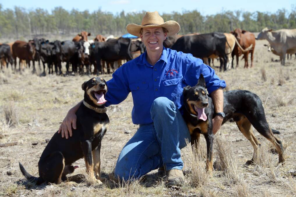 Lachlan Hughes and a couple of his canine mates at home at Dulacca.