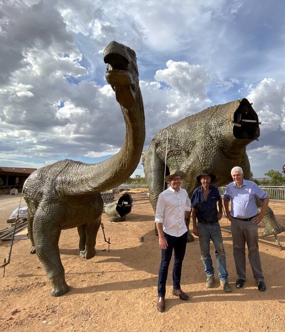 The March of Titanosaurs exhibition towers over Alliance Airlines' CEO Lee Schofield, Australian Age of Dinosaurs founder David Elliott, and airline managing director Scott McMillan during their recent visit. Photos - John Elliott.