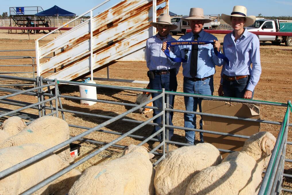 Blue ribbon: Barcaldine Downs manager, Duncan Ferguson, centre, with trade lamb competition organiser, Jan Taylor and competition advisor, Belinda McLeish, Western Livestock Nutrition. Photo: Sally Cripps.