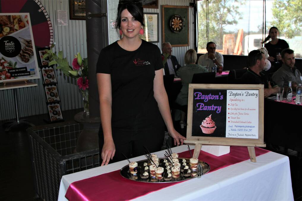 Dulacca Hotel publican Nat Scotney ready to serve 17yo Drillham local Payton Leahy's mini-desserts to launch guests.